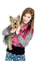 Image showing smiling young girl with her pet yorkshire