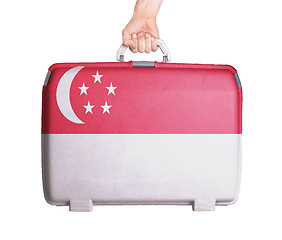 Image showing Used plastic suitcase with stains and scratches