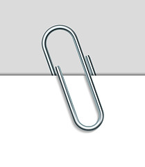 Image showing Metal paperclip and paper