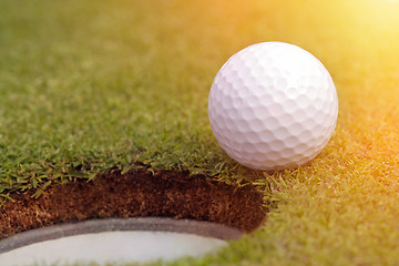 Image showing Golfball almost in the hole 