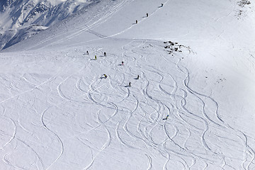 Image showing Snowboarder downhill on off piste slope with newly-fallen snow