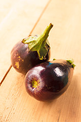 Image showing Eggplants On A Wooden Background