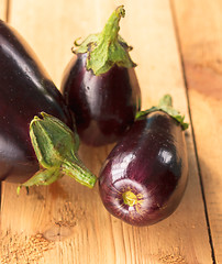 Image showing Eggplants On A Wooden Background