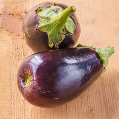 Image showing Eggplants On A Wooden Background