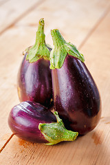 Image showing Eggplants On A Wooden Background