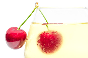 Image showing Pair of ripe cherry berries on wineglass
