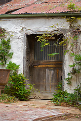 Image showing A Weathered Door on a Derelict Outbuilding