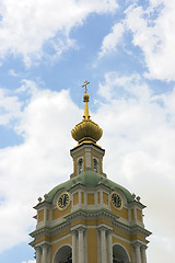 Image showing russian bell tower with clock on blue sky background