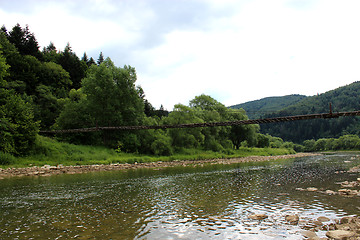Image showing nice bridge across the speed mountainous river