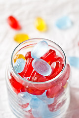 Image showing colorful candies in glass jar 