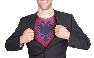 Image showing Businessman opening suit to reveal shirt with flag