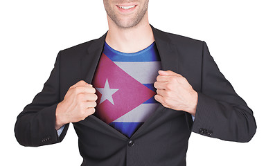 Image showing Businessman opening suit to reveal shirt with flag