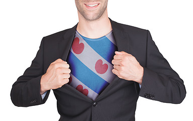 Image showing Businessman opening suit to reveal shirt with flag