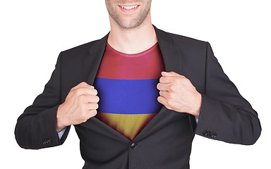 Image showing Businessman opening suit to reveal shirt with flag