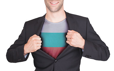 Image showing Businessman opening suit to reveal shirt with flag