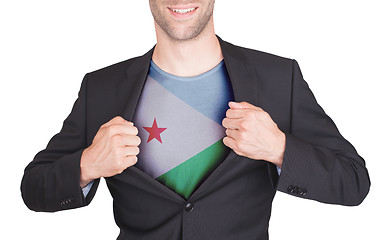 Image showing Businessman opening suit to reveal shirt with flag