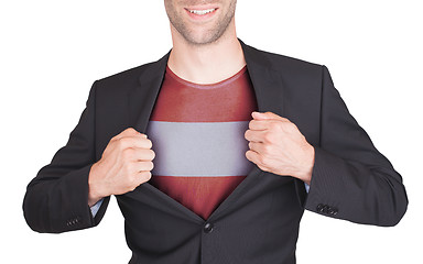 Image showing Businessman opening suit to reveal shirt with flag