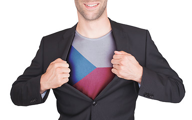 Image showing Businessman opening suit to reveal shirt with flag