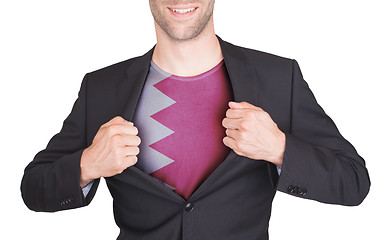 Image showing Businessman opening suit to reveal shirt with flag