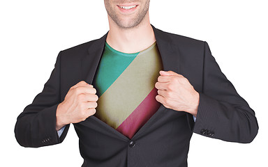 Image showing Businessman opening suit to reveal shirt with flag