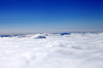 Image showing Mountains in clouds at nice sun day