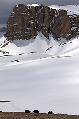 Image showing Snowy plateau and three backpack