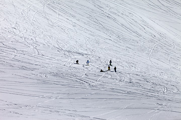 Image showing Snowboarders and skiers on off-piste slope