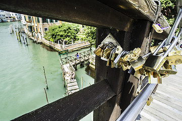 Image showing Padlocks of lovers placed on the bridge