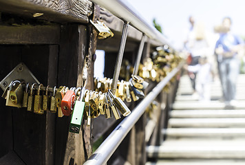 Image showing Padlocks of lovers placed on the bridge