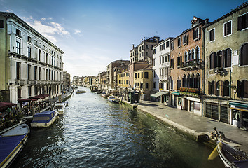 Image showing Ancient buildings and boats in the channel in Venice