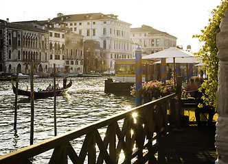 Image showing Ancient buildings and boats in the channel in Venice.