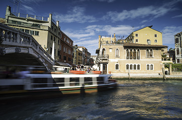 Image showing Ancient buildings and boats in the channel in Venice