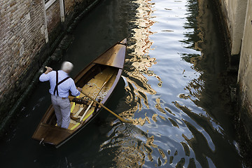 Image showing Man on a boat in Venice