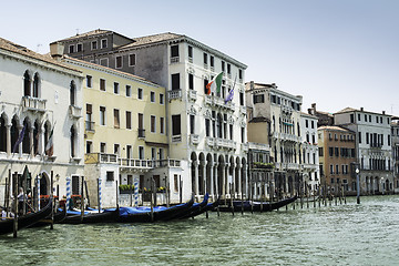 Image showing Ancient buildings and boats in the channel in Venice