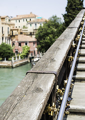 Image showing Padlocks of lovers placed on the bridge