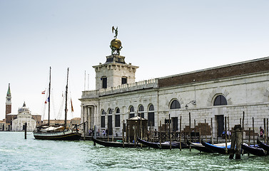 Image showing Ancient buildings and boats in the channel in Venice