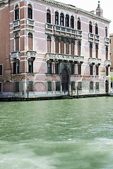 Image showing Ancient buildings and boats in the channel in Venice