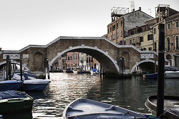 Image showing Ancient buildings and boats in the channel in Venice