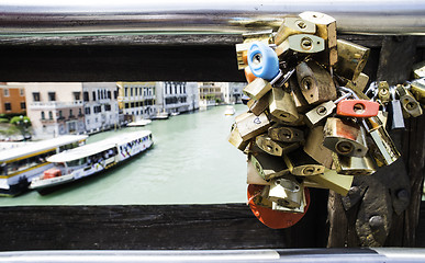 Image showing Padlocks of lovers placed on the bridge