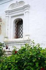 Image showing Barred window - Detail of an old white church