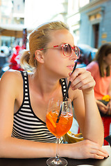 Image showing Woman with cocktail in street cafe.