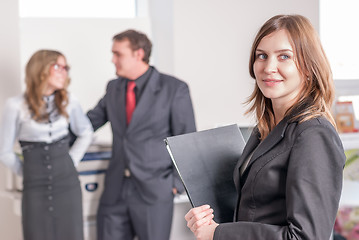 Image showing Smiling young woman in office