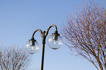 Image showing glass street lamp on blue sky background 