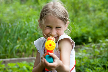 Image showing small girl with toy water gun