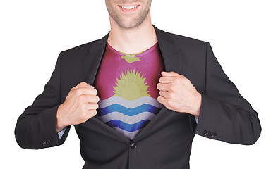 Image showing Businessman opening suit to reveal shirt with flag