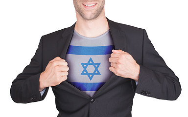 Image showing Businessman opening suit to reveal shirt with flag