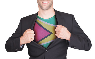 Image showing Businessman opening suit to reveal shirt with flag