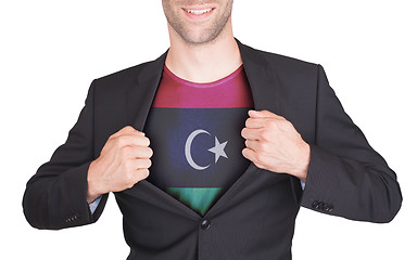 Image showing Businessman opening suit to reveal shirt with flag