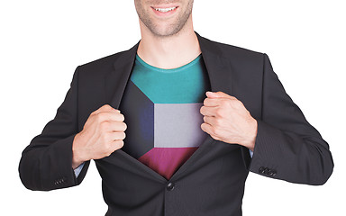 Image showing Businessman opening suit to reveal shirt with flag