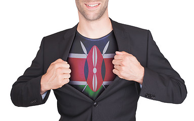 Image showing Businessman opening suit to reveal shirt with flag